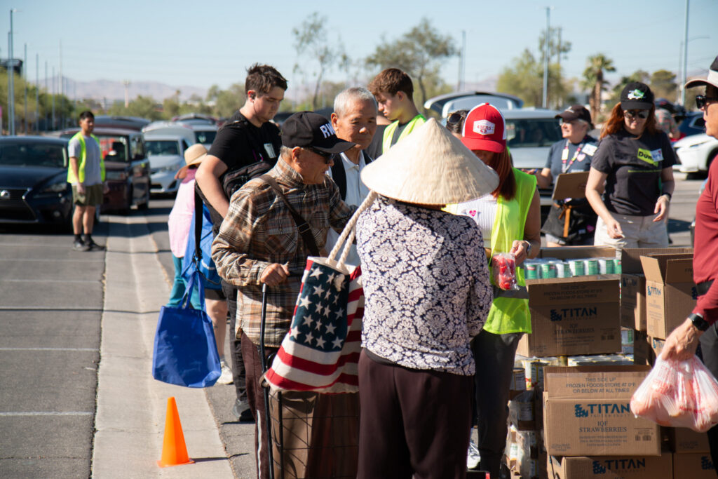 The Just One Project volunteers provide groceries to community members at a Southern Nevada food distribution.
